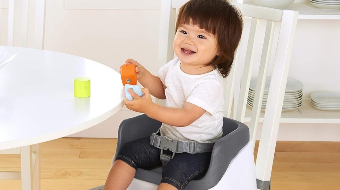 Young girl sitting in a high chair