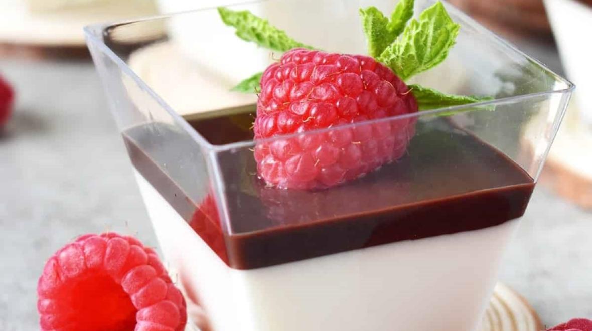 Panna Cotta with chocolate Jello with a raspberry and mint leaves on top
