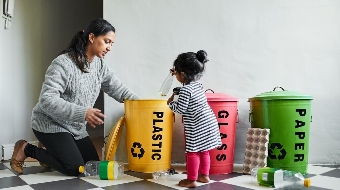 Mom and daughter sorting recycling