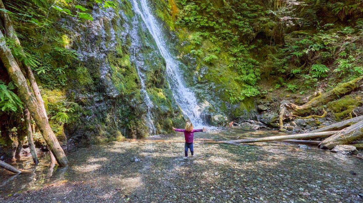 Little girl at a waterfall in Washington