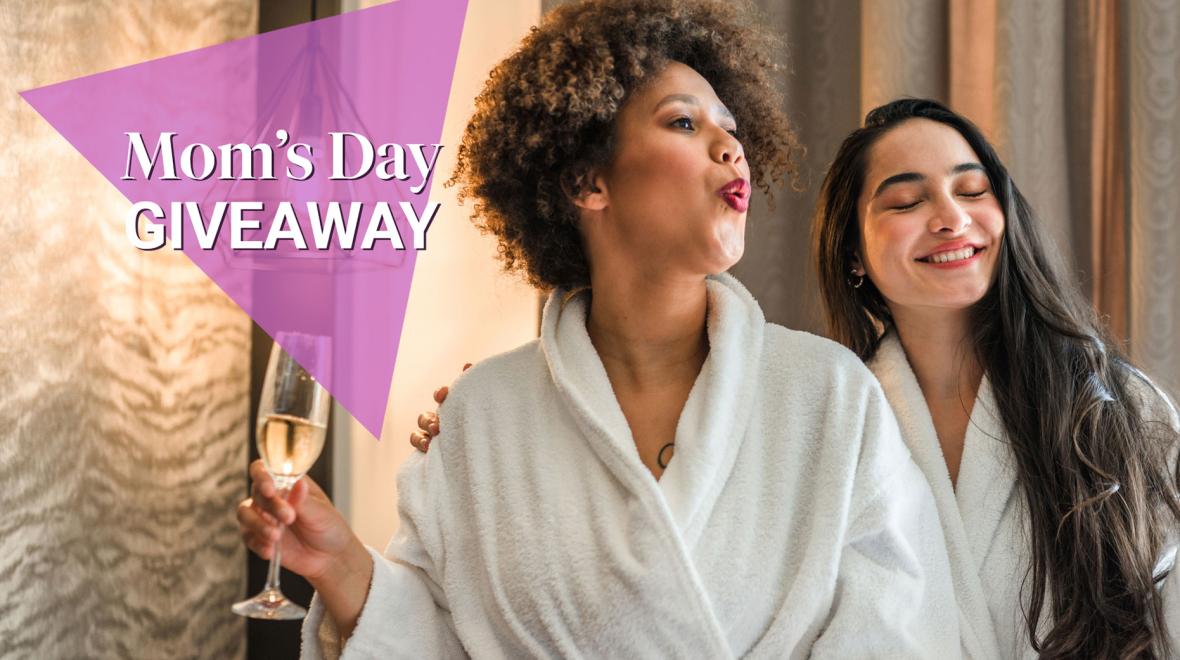 Mom's Day Giveaway (two female friends relaxing in white robes holding champagne, credit iStock)