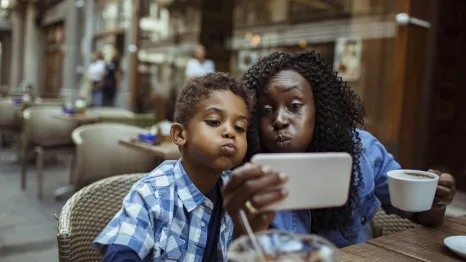 Mom-and-son-at-cafe-taking-selfie-parent-kid-date-night-ideas