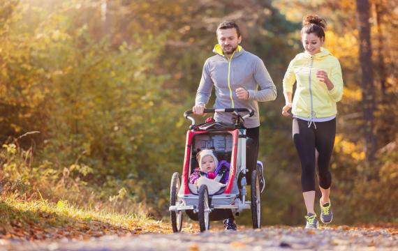 family running with stroller on paths around Seattle and the Eastside