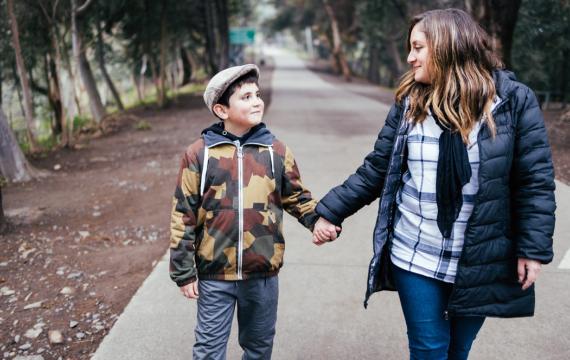 Mom and son walking and having a mental health check in