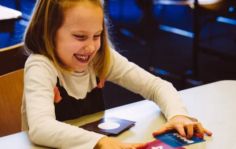 Little girl playing Tiny Polka Dot math game