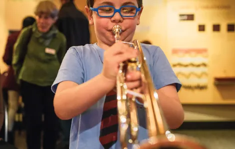 A young musician practices at the Seattle Symphony