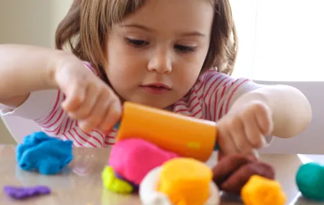 Girl playing with play-dough