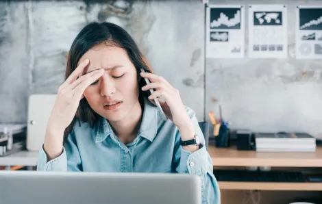 Woman stressed at computer
