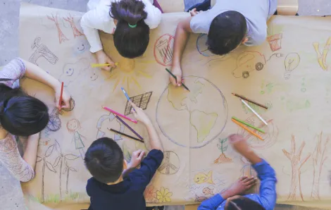 kids coloring a globe