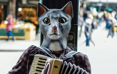 person wearing a rubber cat mask playing an accordion in Pike Place Market 