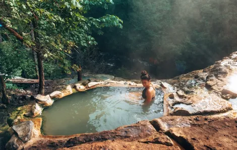relaxing in a natural hot springs in Oregon