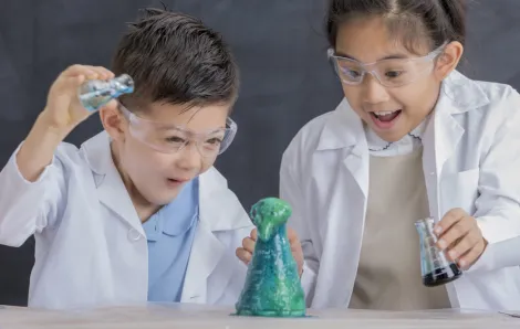Kids doing a science experiment STEM activities for kids