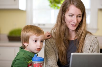 Mom and toddler check out resources online