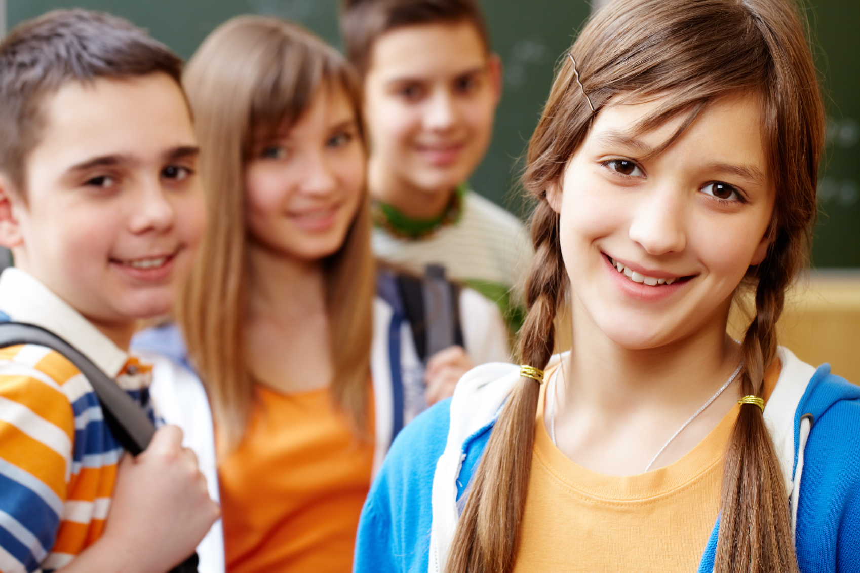 How to choose the right school for your child - happy girl goes to high school with her friends