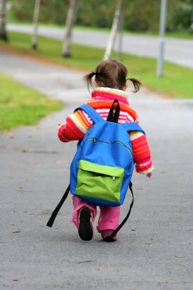 Cute little girl walking to preschool