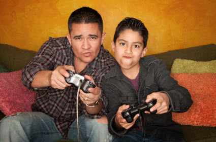 Dad and son playing video games