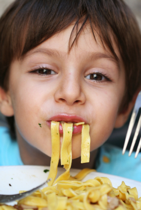 Kid grubbin' on pasta