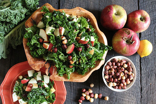 Healthy Thanksgiving side dish: Kale salad with Fuji apples and maple-spiced hazelnuts by Nutrition Stripped