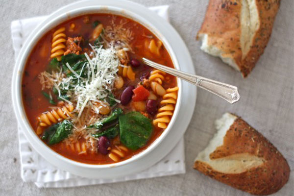 Make-ahead meals for new parents: Sausage, bean, pasta soup with spinach by Simple Bites