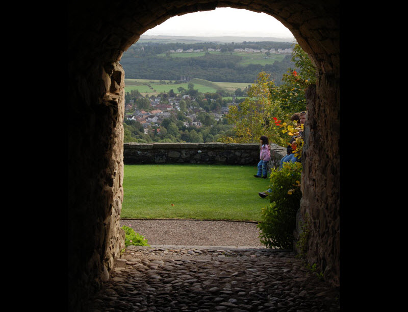 kids viewed through a scotland castle doorway