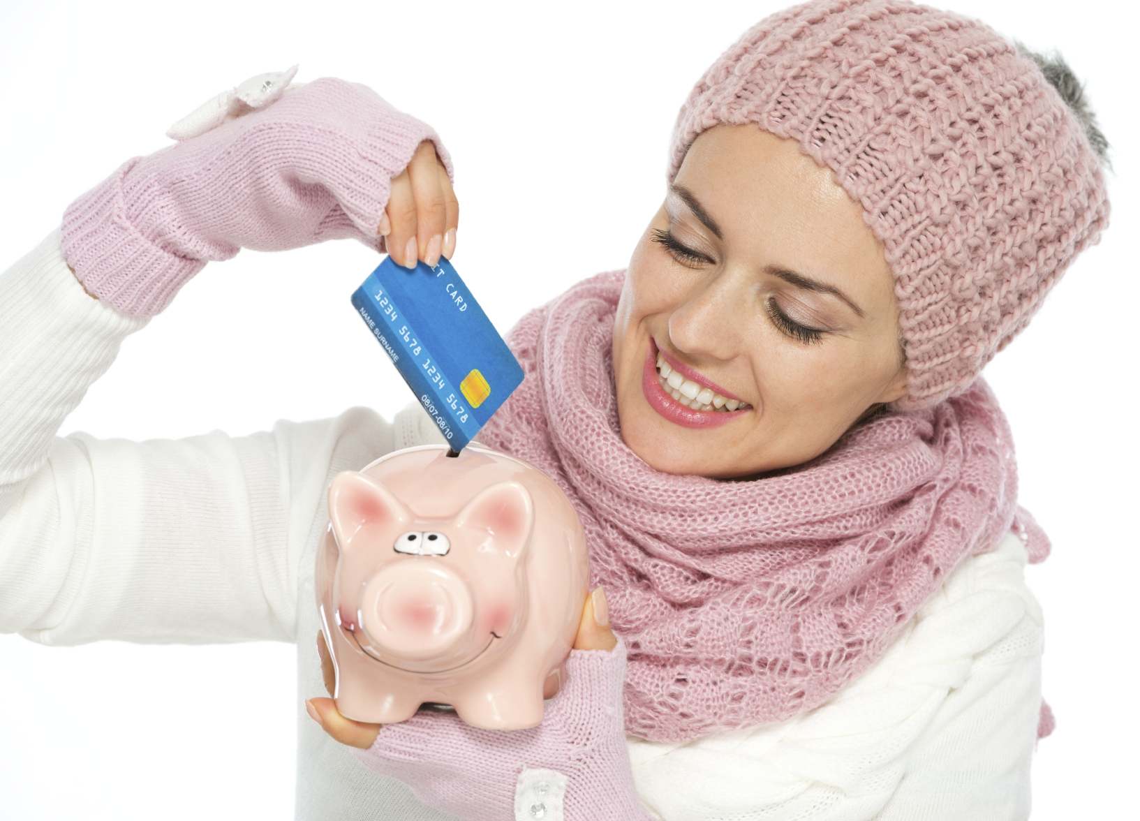 woman mother putting credit card into piggy bank saving points for traveling and airline miles