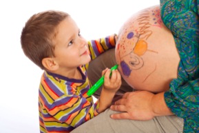 Boy drawing on belly