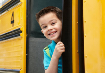 little boy happy on the bus