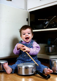 Baby with pots and pans