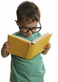 Boy reading with glasses