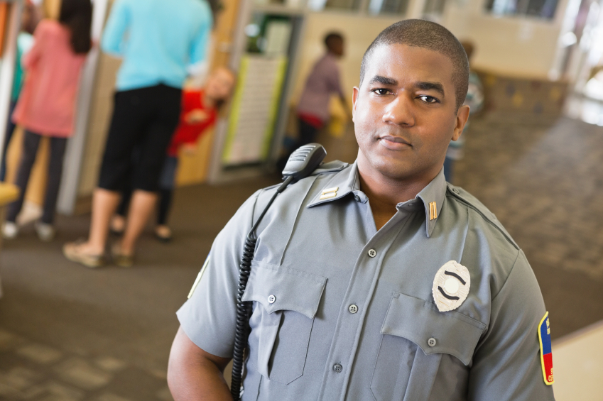 school safety preventing shootings police security officer in hallway class