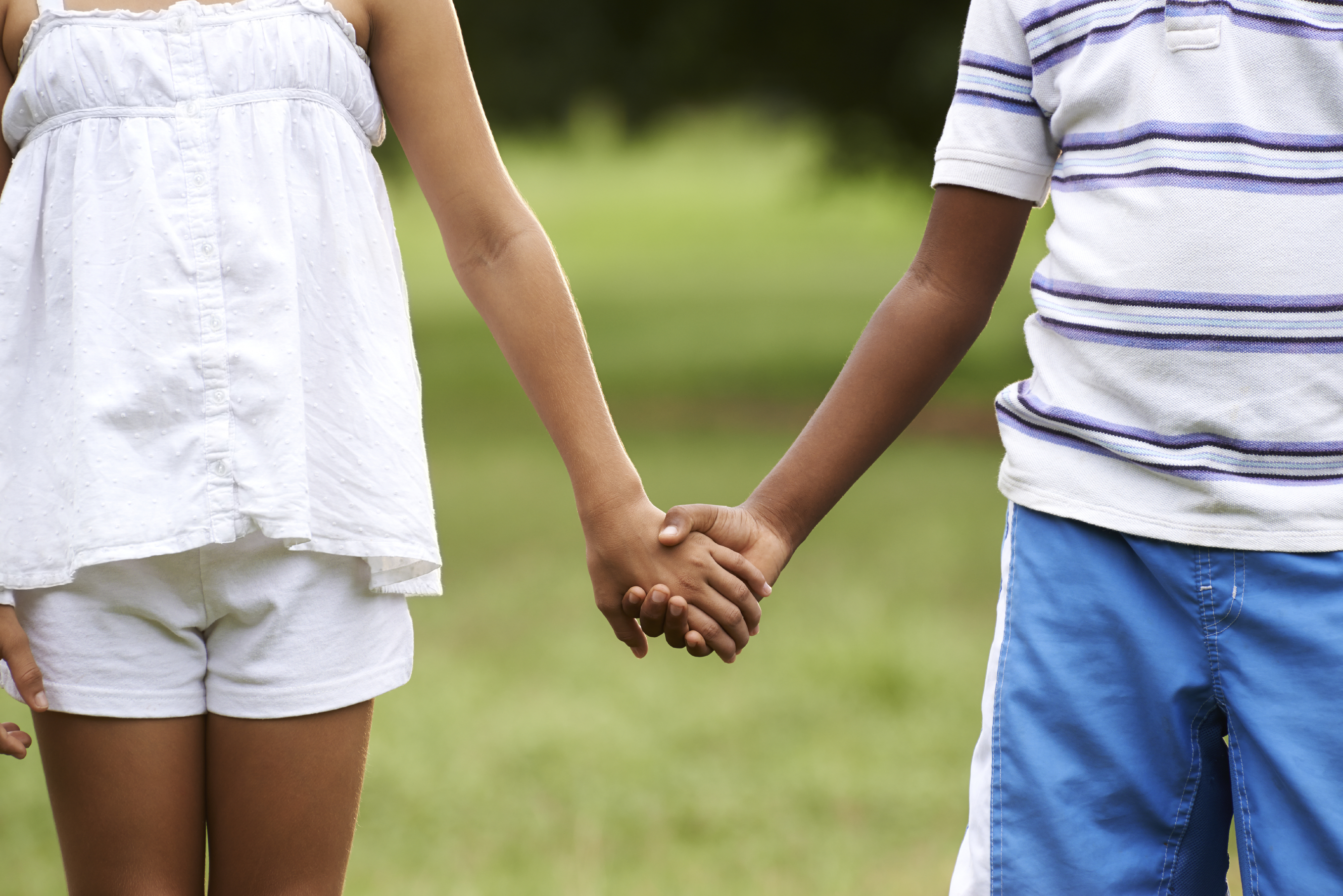 elementary school boy girl holding hands love