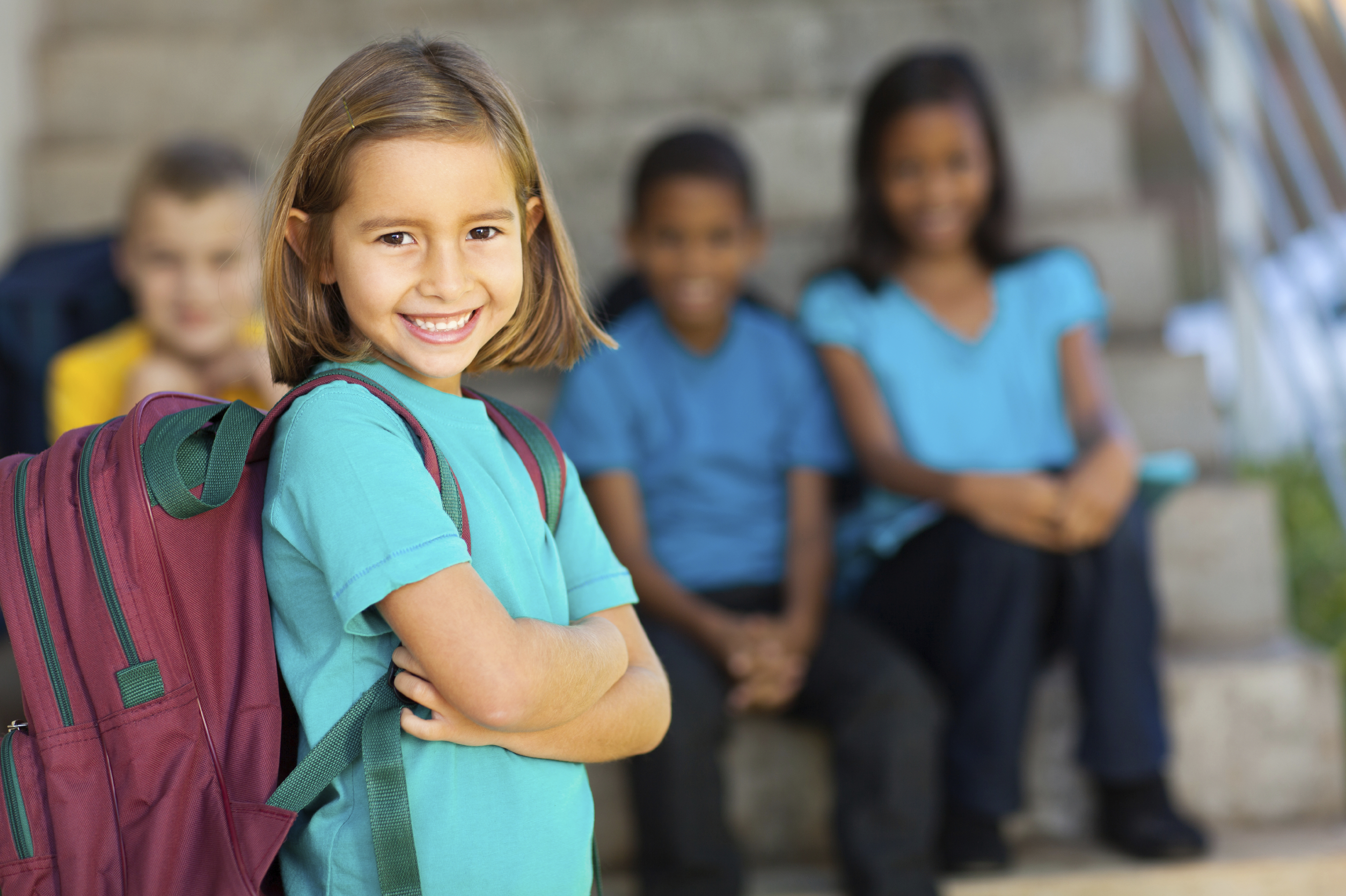 girl with backpack starting elementary school