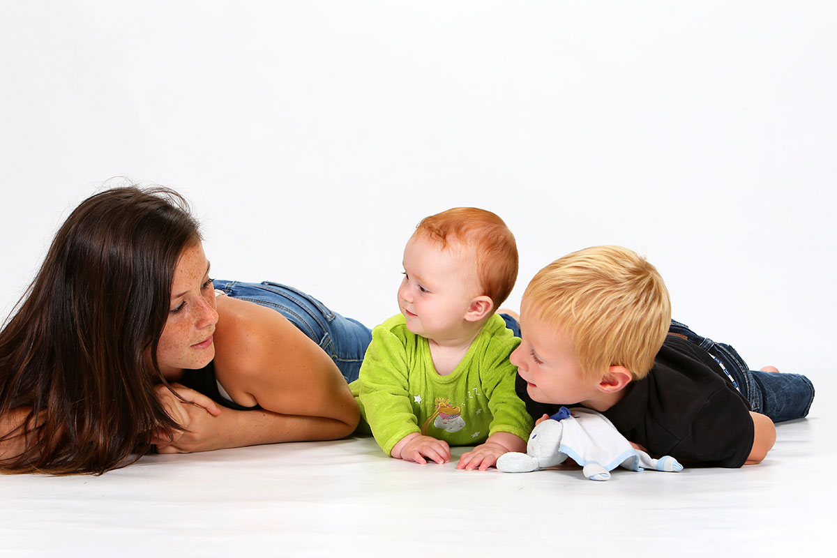 female babysitter babysitting young brothers