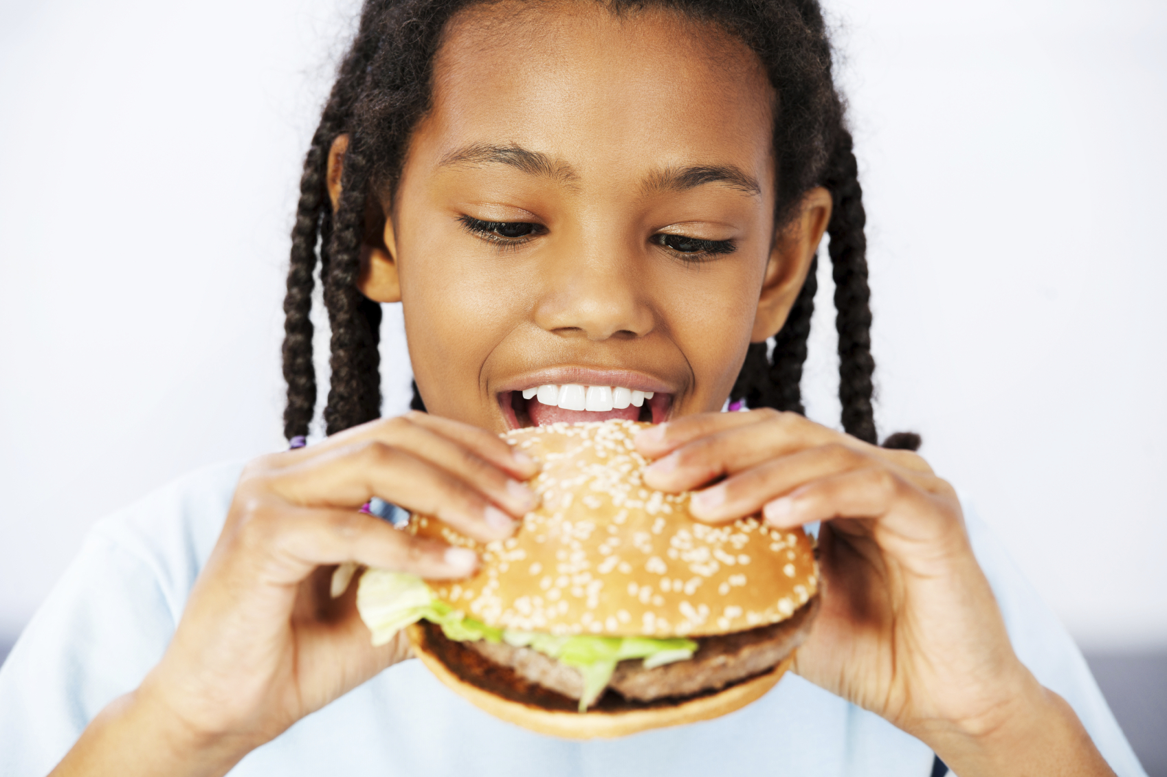 Say it discover. African eat Burger. Children eat fast food. Child Burger. A girl is eating Junk food.