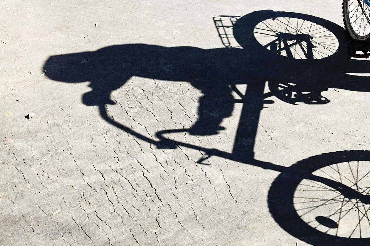 shadow of girl on bike