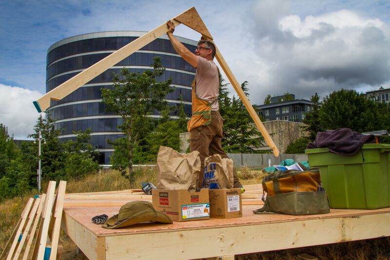 Dan Webb building his shack. Photo credit: Olympic Sculpture Park
