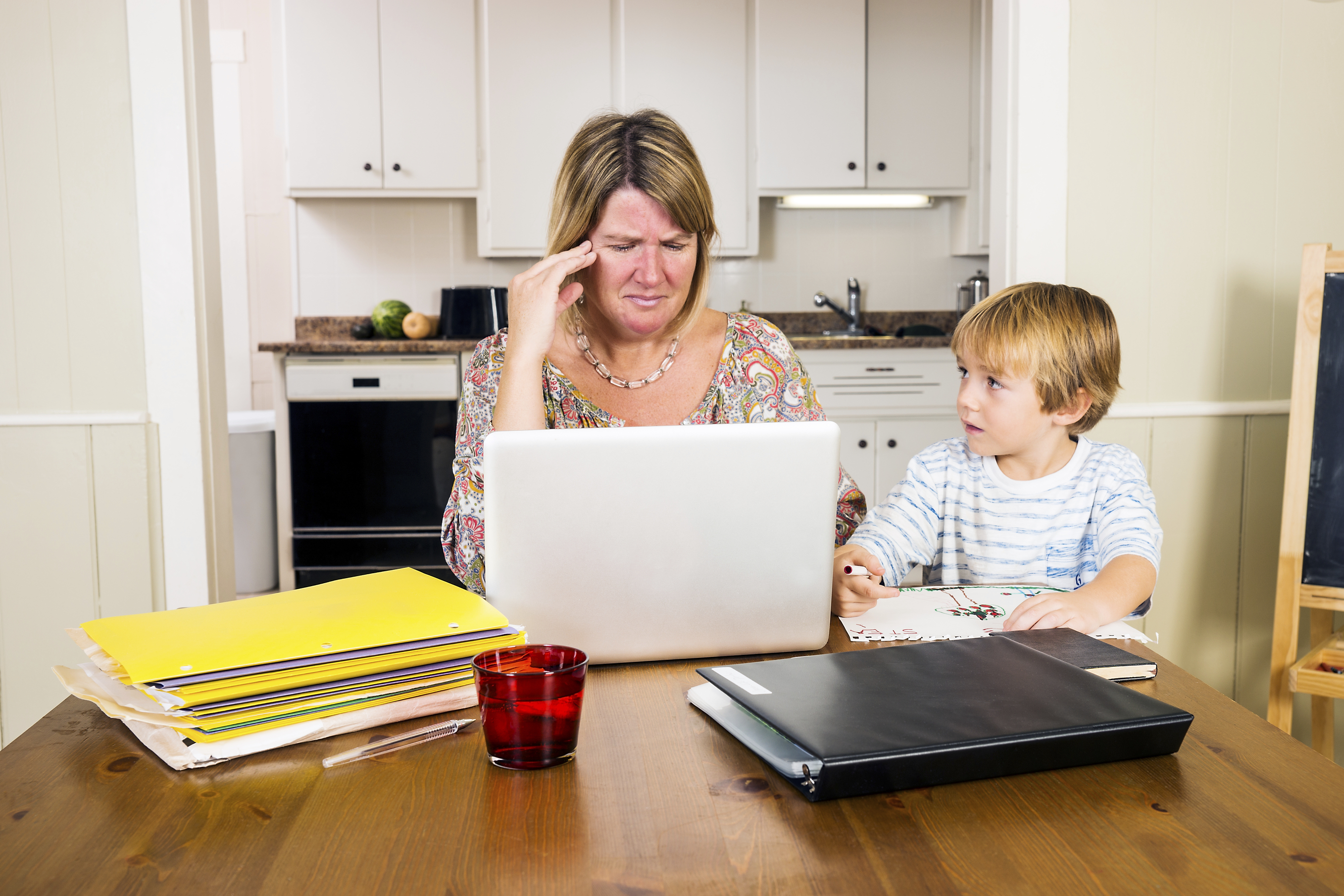 Stressed mom looking at computer