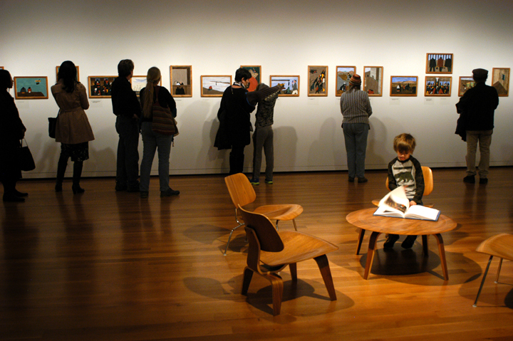  Jasper Pope, 7, of Shoreline, looks through a book about Jacob Lawrence’s Migration Series at the Seattle Art Museum. Photo credit: JiaYing Grygiel