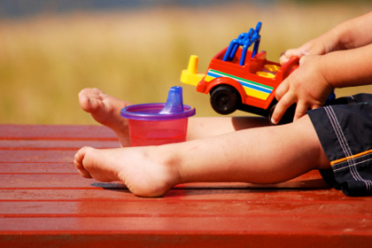 Photo of a child playing with a toy truck, courtesy of ParentMap