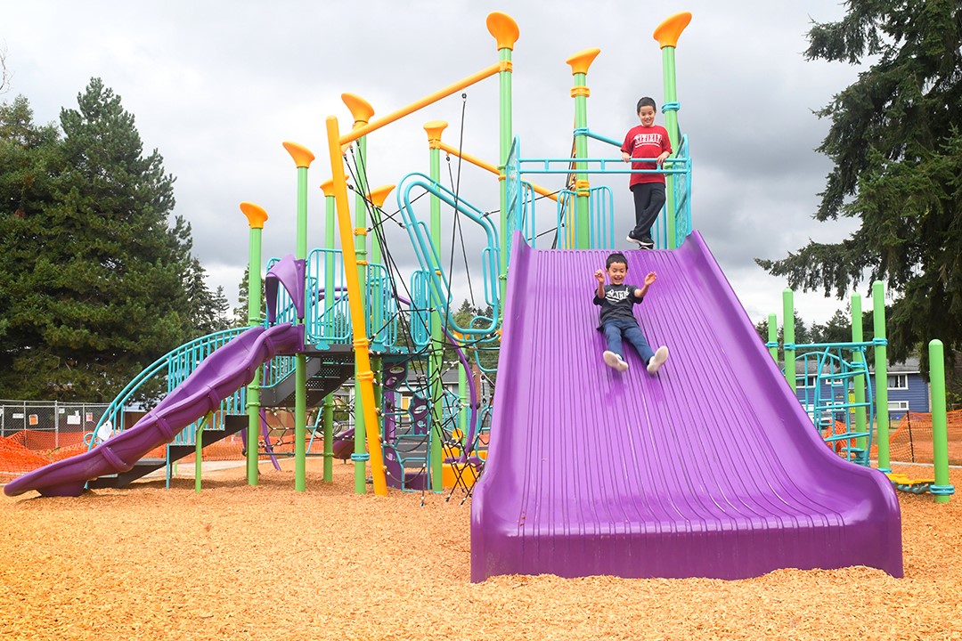 The giant purple slide at the new playground at Cascade Park in Renton