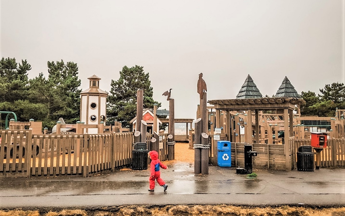 ""On a gray fall day, kids play at Playground by the Sound at Chambers Creek Regional Park in University Place near Tacoma one of Puget Sound area’s biggest parks