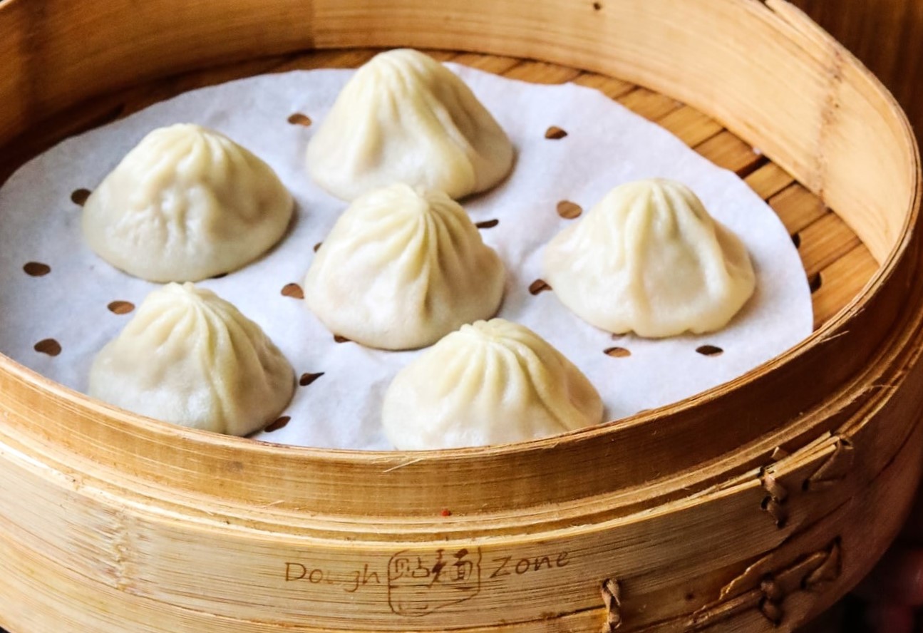 Dough Zone best Asian restaurants in Seattle best Chinese dough zone soup dumplings in a steamer basket