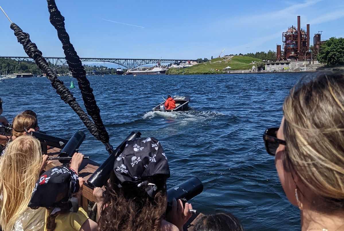 Families aboard the Family Treasure Cruise with Emerald City Pirates enjoy the Seattle views of landmarks such as Gas Works Park