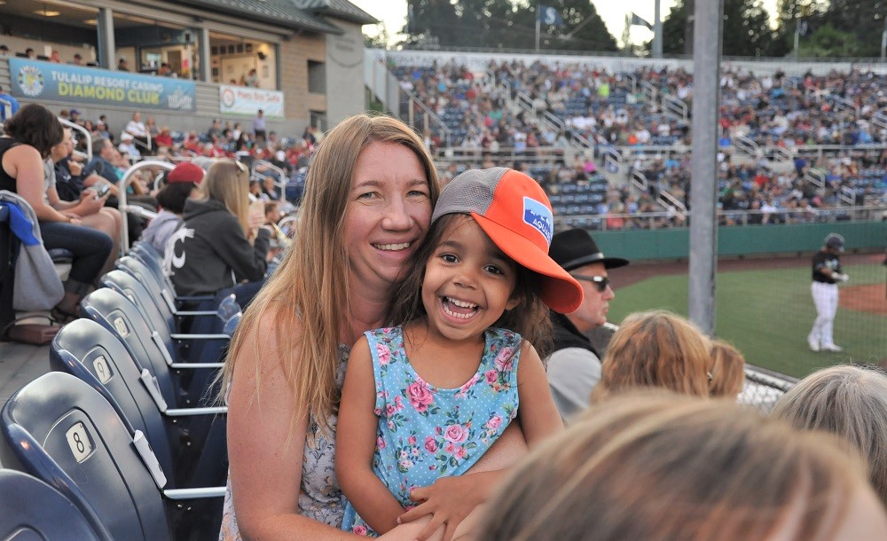 ParentMap writer and mom Jenna Vandenburg enjoys an Everett AquaSox game alongside her daughter Aubrey