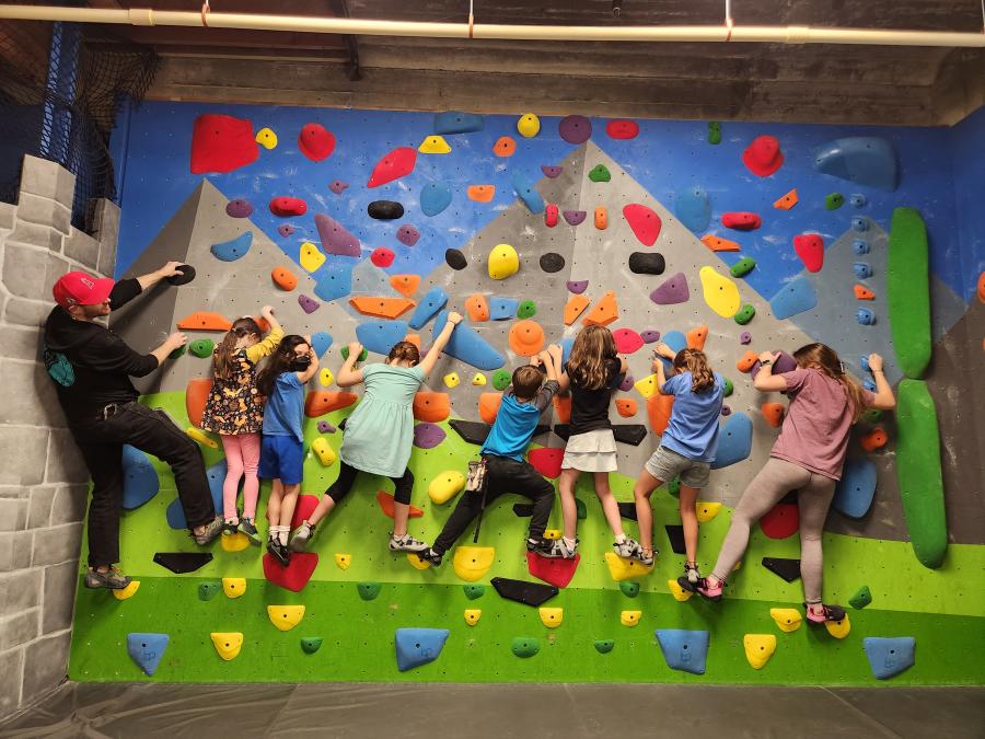 Climb as high as you can on a bouldering wall. Photo credit: Half Moon Bouldering