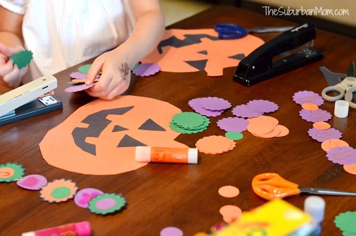 "Kids working on a Halloween countdown craft"