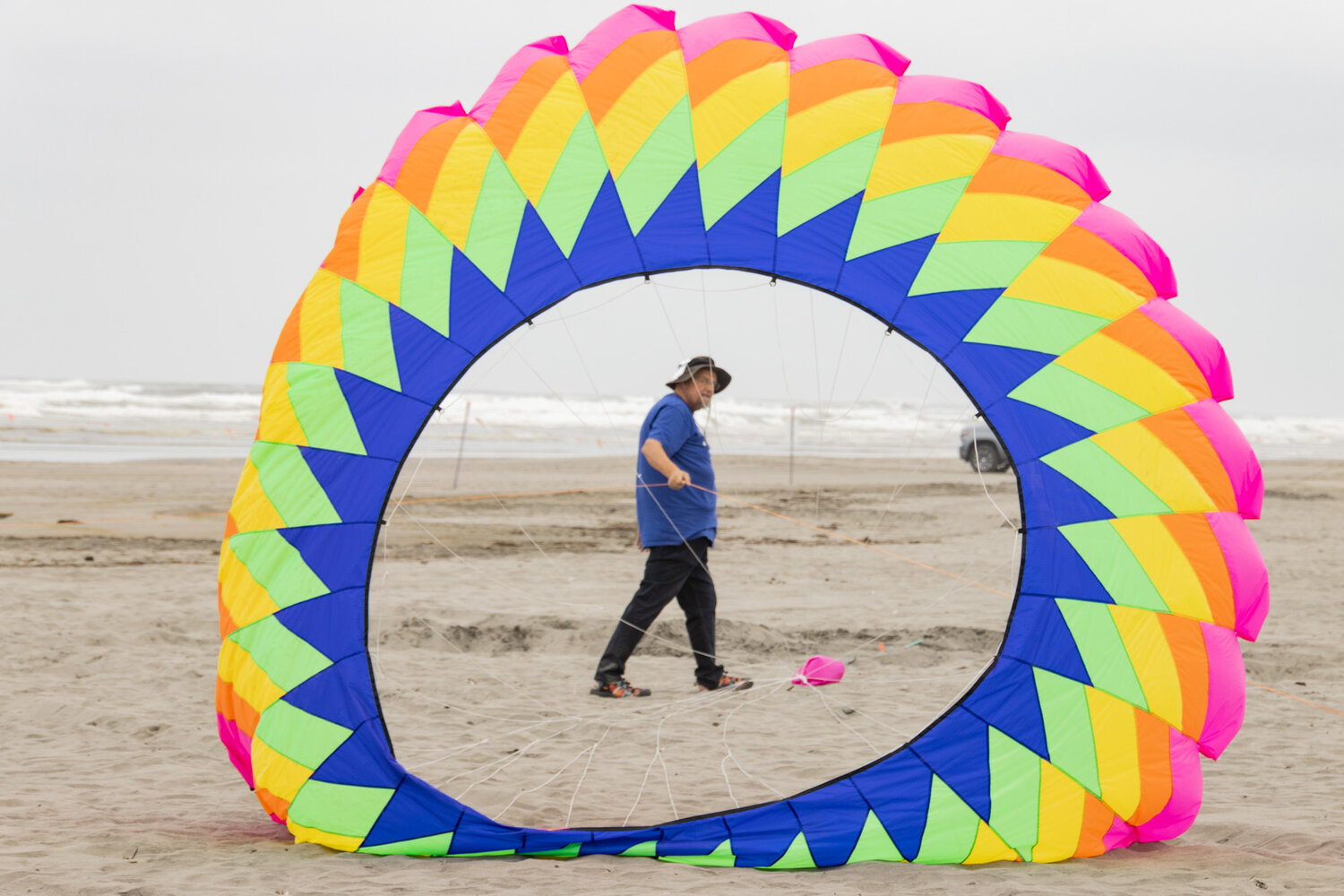 A colorful circular kite gets ready to fly at the Washington State International Kite Festival in Long Beach