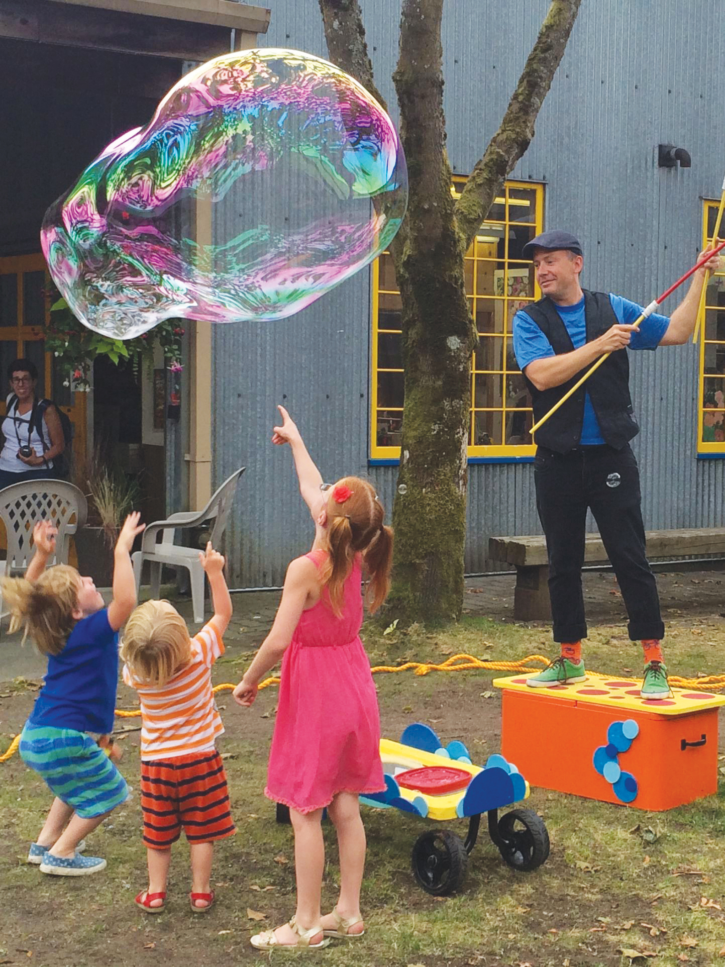 "Matt Henry's Big Bubble show. Man blowing a giant bubble for kids."