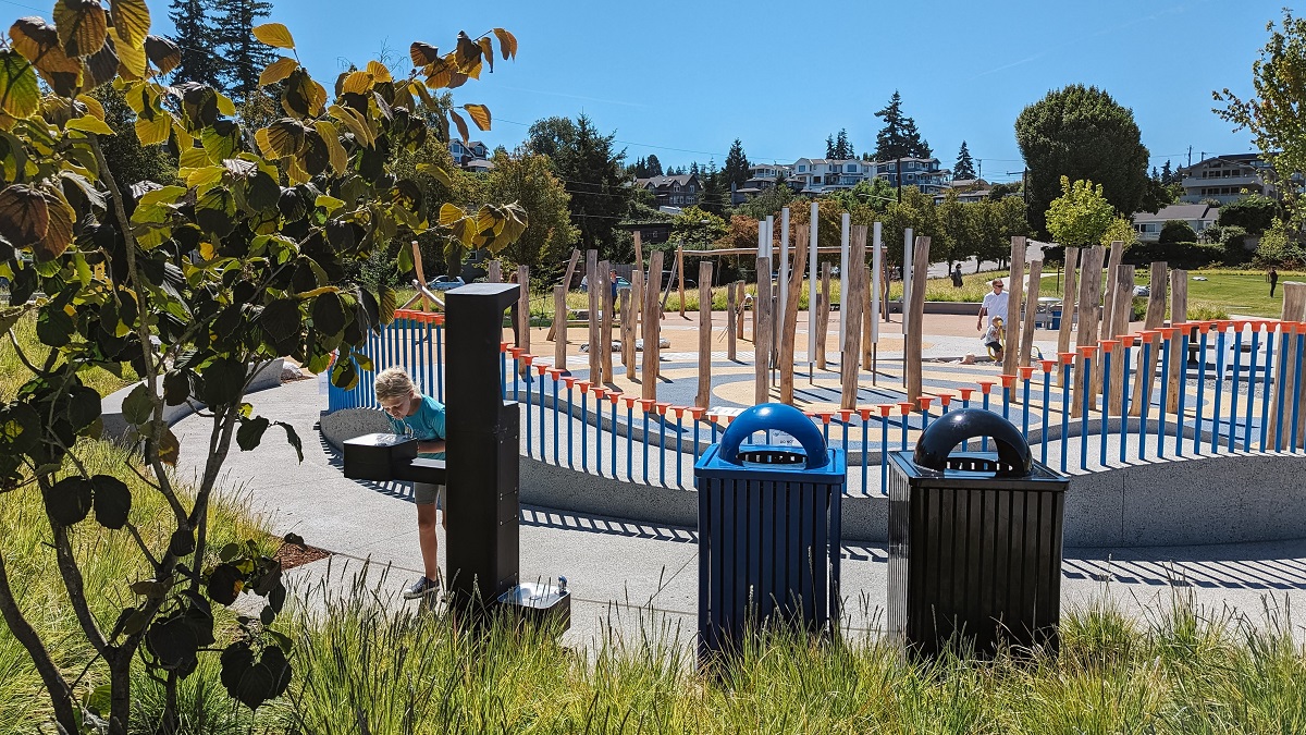 A girl gets a drink of water next to Mika’s Playground just installed at Edmonds’ Civic Center Playfield