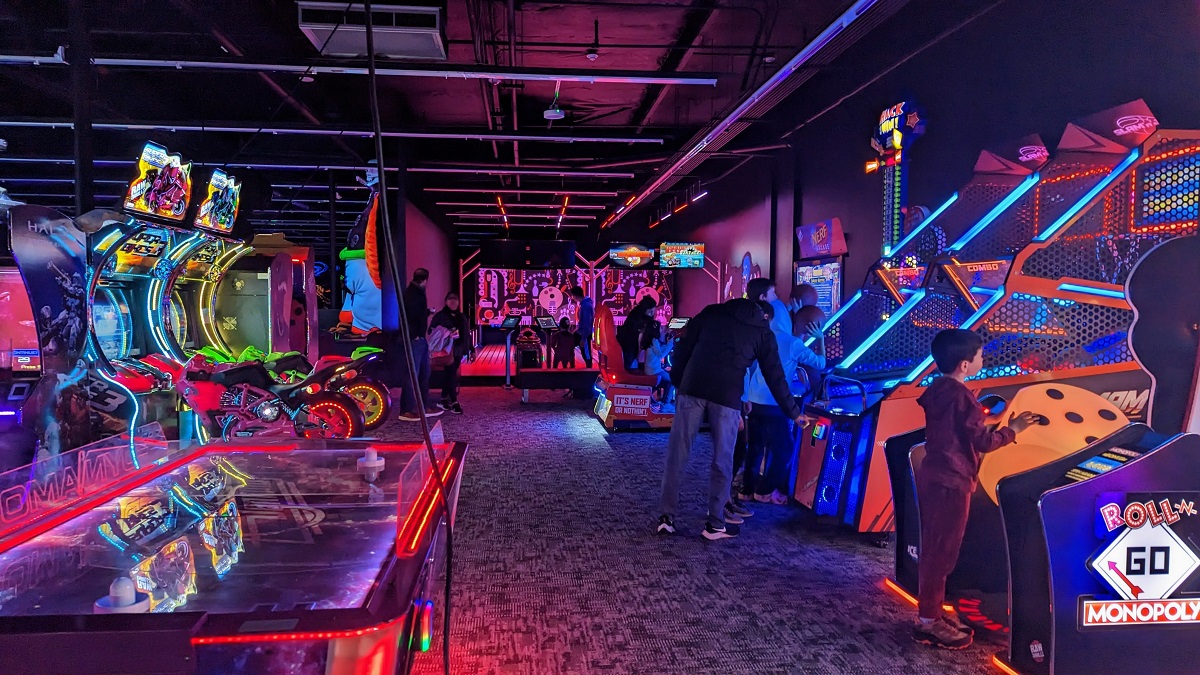 Kids and families play arcade games at Monster Mini Golf new indoor family entertainment venue in Bellevue Washington Seattle fun for families